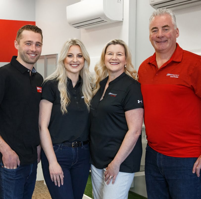 Smiling Hot Frost team members posing for a photo in our showroom